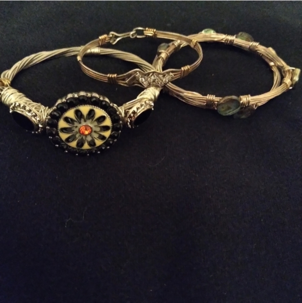 Set of 4 silver tone wire bracelets